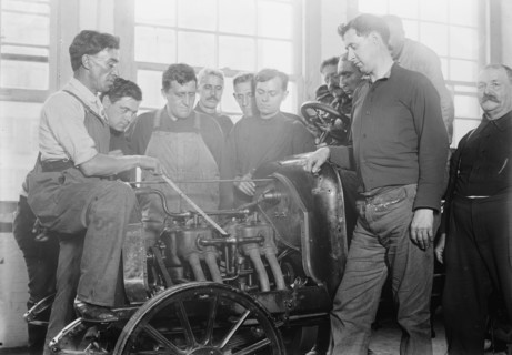 Firemen studying auto motor, between c1910 and c1915. Creator: Bain News Service.