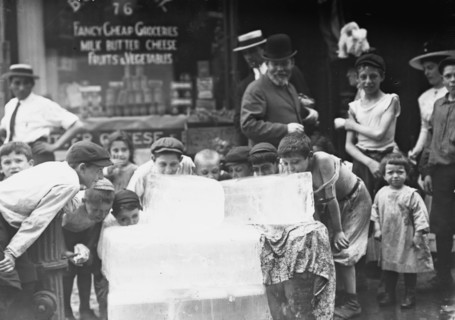 Licking blocks of ice on hot day, between c1910 and c1915. Creator: Bain News Service.