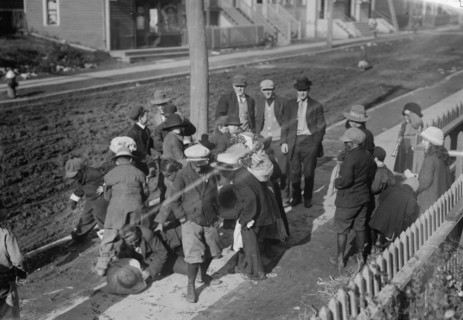 Thanksgiving Maskers scramble for pennies, between c1910 and c1915. Creator: Bain News Service.