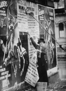 Miss Louise Hall with brush and Susan Fitzgerald assisting bill posting..., between c1910 and c1915. Creator: Bain News Service.