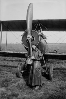 Katherine Stinson with her biplane, 1917 or 1918. Creator: Bain News Service.