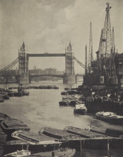 The pool and Tower Bridge. From the album: Photograph album - London, 1920s. Creator: Harry Moult.