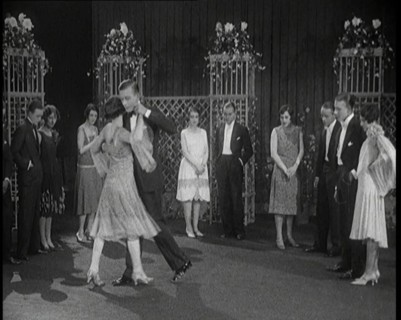 A Group of People Dancing the Charleston. One Female Civilian is Rubbing Her Legs is Pain, 1926. Creator: British Pathe Ltd.