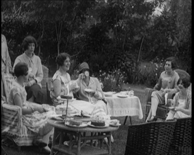 A Group of Female Civilians Drinking Tea and Eating Cakes in the Garden, 1926. Creator: British Pathe Ltd.