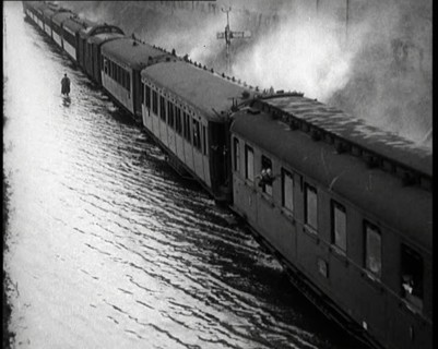 Train Driving Through Flooded Fields and Tracks, 1926. Creator: British Pathe Ltd.