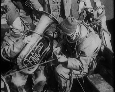 A Diver Coming up from the Sea Carrying a Tuba, 1929. Creator: British Pathe Ltd.