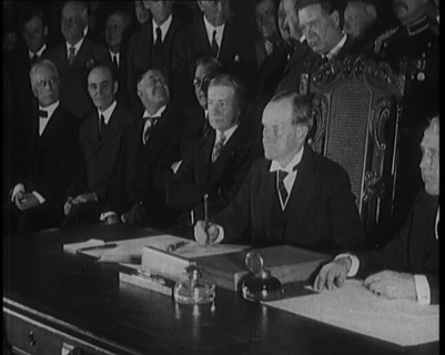 Frank Billings Kellogg Sitting Next to American President Calvin Coolidge Signing the Kellogg...1929 Creator: British Pathe Ltd.