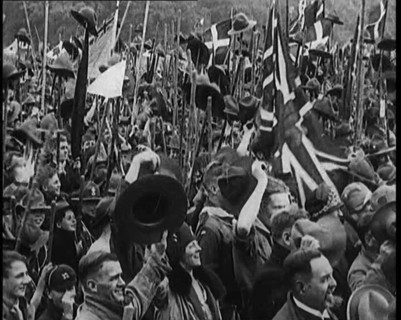 Large Numbers of Boy Scouts and Male Civilians Cheering at Jamboree, 1929. Creator: British Pathe Ltd.