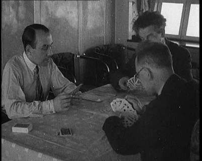 Male Civilians Playing Cards in Gondola of the Zeppelin, 1929. Creator: British Pathe Ltd.