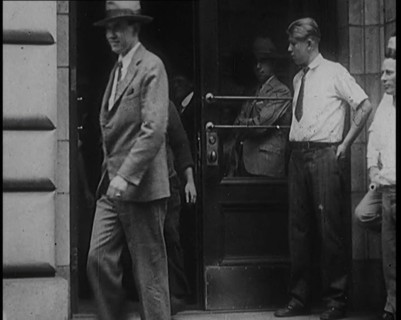 Alcohol Smugglers Coming Out of Court, 1929. Creator: British Pathe Ltd.