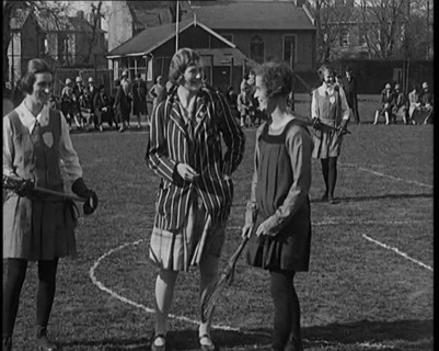 A Female Civilian Tossing a Coin in Front of Two Young Female Lacrosse Players Ahead of the..., 1920 Creator: British Pathe Ltd.