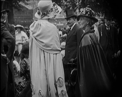 Civilians on the Street Wearing Evening Outfits, Hats and Top Hats, 1920. Creator: British Pathe Ltd.