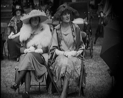 Three Female Civilians Seating Outdoors Wearing Evening Outfits and Hats, 1920. Creator: British Pathe Ltd.
