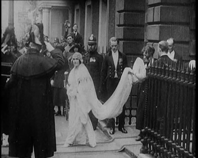 The Duke of York and Lady Elizabeth Bowes-Lyon Emerging from a House on Their Wedding Day, 1920. Creator: British Pathe Ltd.