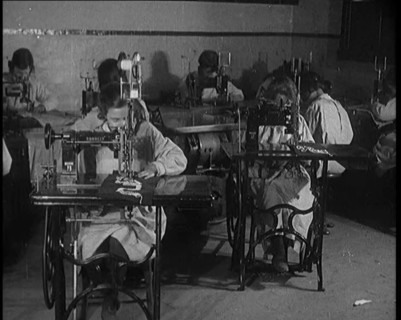 Young Female Civilians Operating Sewing Machines in an Arts Class, 1920. Creator: British Pathe Ltd.