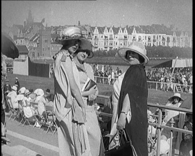 Three Female Civilians Wearing Smart Summer Outfits Posing for the Camera in a Horse Race, 1920. Creator: British Pathe Ltd.