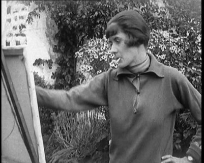 A Female Civilian Painting at an Easel Outdoors Smoking a Cigarette, 1920. Creator: British Pathe Ltd.