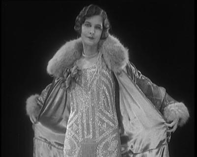 Female Civilian Modelling a Glamorous Fur Trimmed Coat, 1920. Creator: British Pathe Ltd.