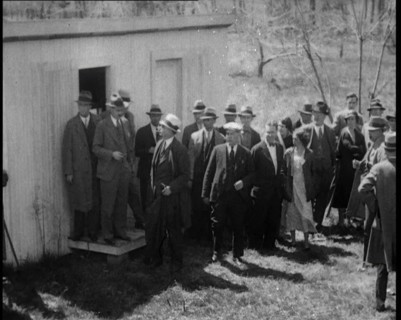 American Police Officers and Civilians in a Cemetery During a Kidnapping Investigation, 1930s. Creator: British Pathe Ltd.
