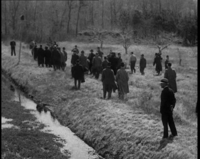American Police Officers Searching the Area Outside American Aviator Charles Augustus..., 1930s. Creator: British Pathe Ltd.