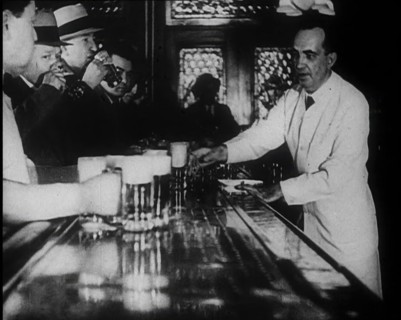 American Civilians Celebrating the End of Prohibition Drinking in a Bar, 1930s. Creator: British Pathe Ltd.