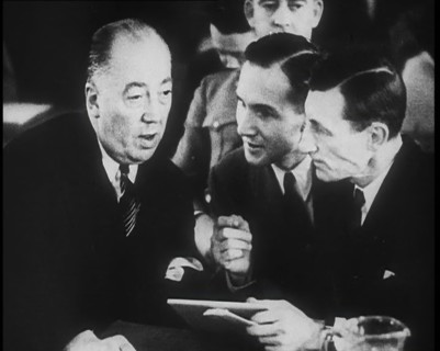 Bruno Richard Hauptmann Talking To His Attorney Edward J. Reilly in a Courtroom During His..., 1930s Creator: British Pathe Ltd.