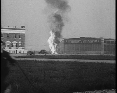 Plume of Flame Emitting from the ‘Bellanca’ Crash as People Attend to Wreckage, 1933. Creator: British Pathe Ltd.