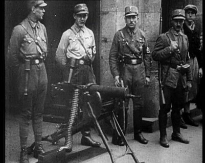 Uniformed Nazis Standing Next to a Machine Gun, 1933. Creator: British Pathe Ltd.