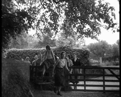 Hikers Climbing over a Gate, 1933. Creator: British Pathe Ltd.