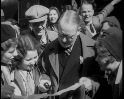 People Looking at  a Paper Together, 1933. Creator: British Pathe Ltd.