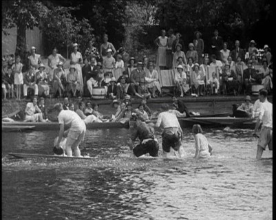 People in Sinking Rowing Boat, Watched by Crowd, 1933. Creator: British Pathe Ltd.
