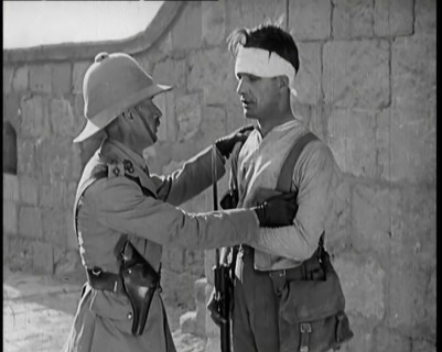 Scene from a Film: Male Actor Playing a Survivor from the Battle Being Questioned..., 1920s. Creator: British Pathe Ltd.