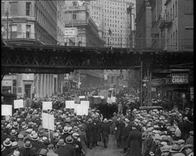 Crowd Walking Parading Down a Road and Holding Signs, 1933. Creator: British Pathe Ltd.