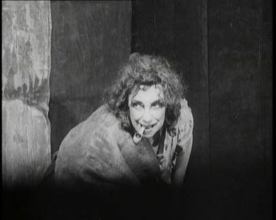 Helen Tree Performing in Heavy Makeup and Smoking a Pipe, 1922. Creator: British Pathe Ltd.