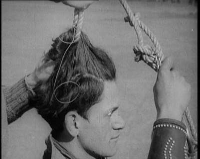 Native American Man Having a Rope Tied Into His Hair, 1921. Creator: British Pathe Ltd.