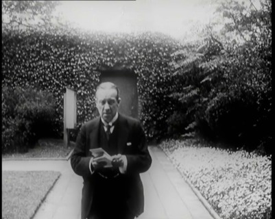 Prime Minister of Britain, Stanley Baldwin, Walking in the Gardens at Chequers Whilst Reading, 1926. Creator: British Pathe Ltd.