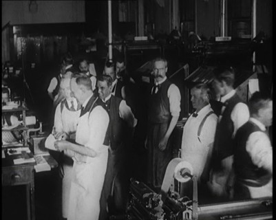 Male Screen Printers Working in a News Room, Using Various Pieces of Printing Machinery, 1921. Creator: British Pathe Ltd.