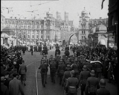 German Soldiers Marching Down a Street as a Crowd Watches, 1930s. Creator: British Pathe Ltd.