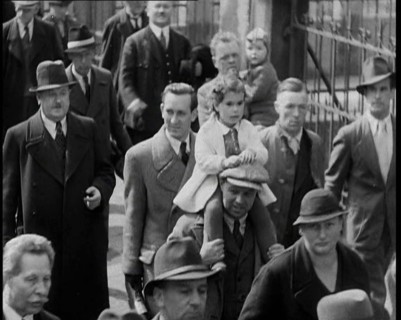 Crowd Walking Down a Pavement, 1930s. Creator: British Pathe Ltd.