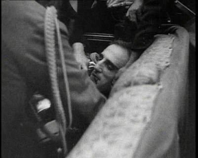 People Inspecting a Corpse, 1934. Creator: British Pathe Ltd.