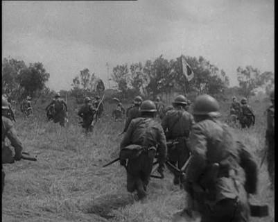 Japanese Soldiers Running Through a Field, 1933. Creator: British Pathe Ltd.