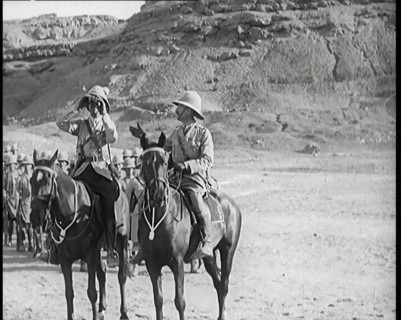 Scene from a Film: a Male Actor Playing a British Soldier on Horseback Looking Through..., 1920s. Creator: British Pathe Ltd.