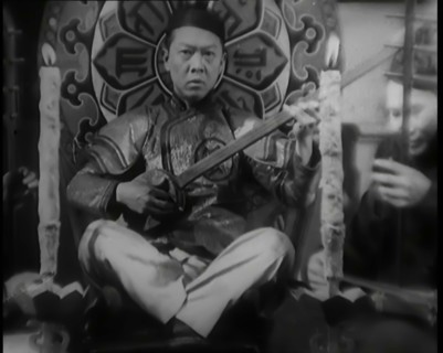 Scene from the Film 'Piccadilly': Male Actor Playing a Lute, 1920s. Creator: British Pathe Ltd.