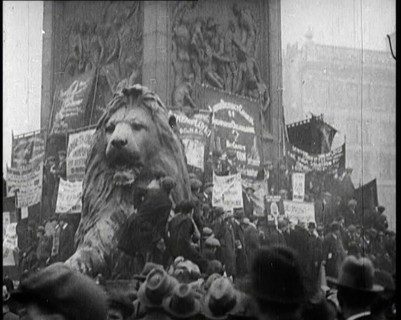 People Climbing Over the Lions at the Foot of Nelson's Column in Trafalgar Square, London..., 1922. Creator: British Pathe Ltd.