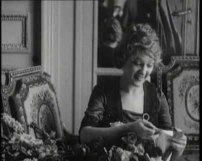 Mary Pickford Talking and Sitting Amongst Flowers in Paris, 1920. Creator: British Pathe Ltd.