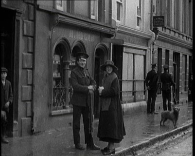 People Walking Along a Desolate Street in Ireland, 1921. Creator: British Pathe Ltd.