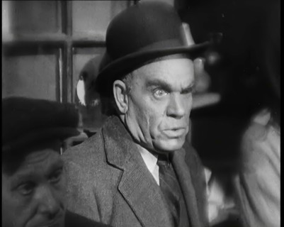 Scene from the Film 'The Informer':  Male Actor Looking at Money Being Thrown on the..., 1920s. Creator: British Pathe Ltd.