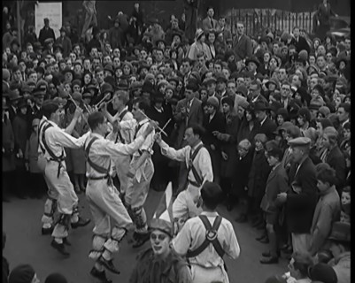 A Crowd of People Watching Morris Dancers Perform, 1931. Creator: British Pathe Ltd.