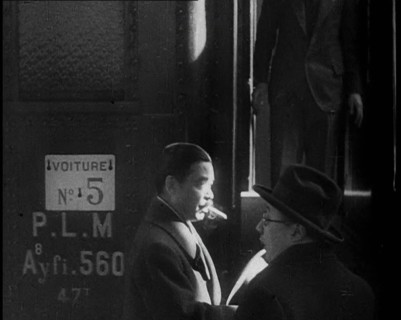 Japanese League of Nations Delegate Walking Past a Train, 1933. Creator: British Pathe Ltd.