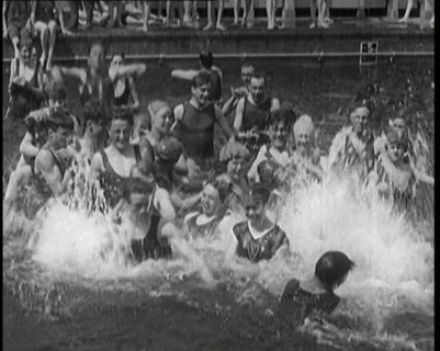 British People Splashing and Playing in the Chiswick Open Air Baths, 1920. Creator: British Pathe Ltd.